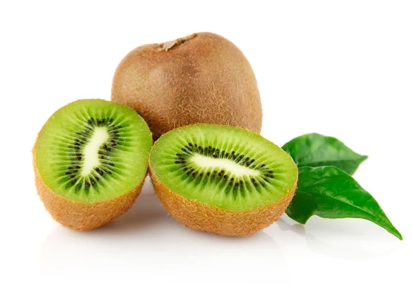 Fresh kiwi with cut and green leaves — Stock Photo, Image