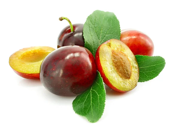Ripe plums with cut and leaf isolated — Stock Photo, Image