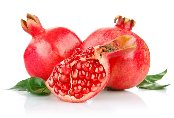 stock image Pomegranate fresh fruits with cut and green leaves