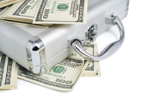 Förpackningar av dollar pengar på silver resväska — Stockfoto