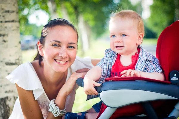 Mother with baby in stroller — Stock Photo, Image