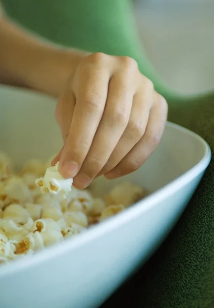 Eating popcorn Royalty Free Stock Images