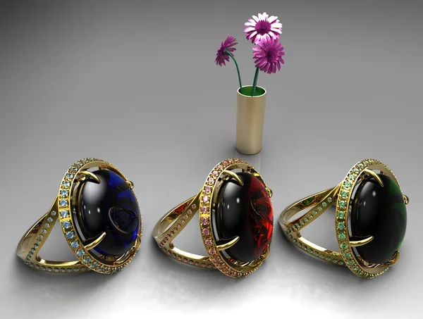 Elegante vrouwelijke sieraden gouden ringen met bloemen — Stockfoto