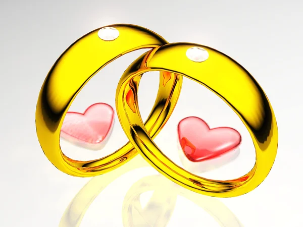 Wedding rings and hearts — Stock Photo, Image