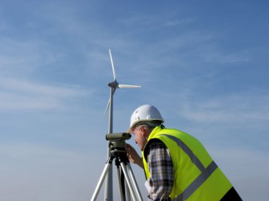 Surveyor and wind turbine clipart