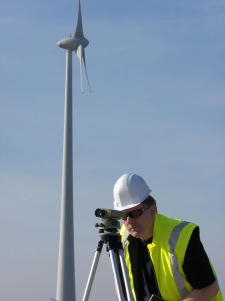 Surveyor and wind turbine — Stock Photo, Image