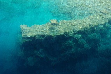 Fragment of ruins of underwater Kekova city clipart