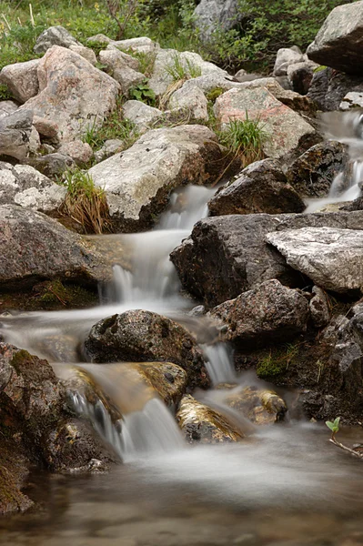 stock image Small waterfall in stones