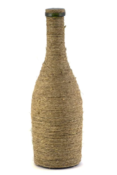 Бутылка плетена из льна — стоковое фото