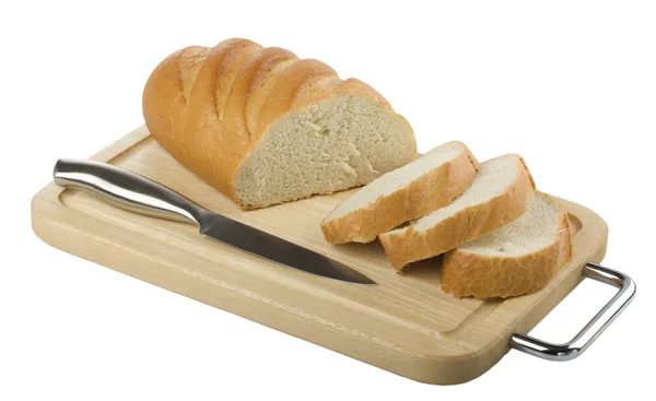 Szeletelt hosszú kenyeret és egy kés, egy vágódeszka — Stock Fotó