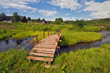 Wooden bridge, the river, the old house, Russia clipart