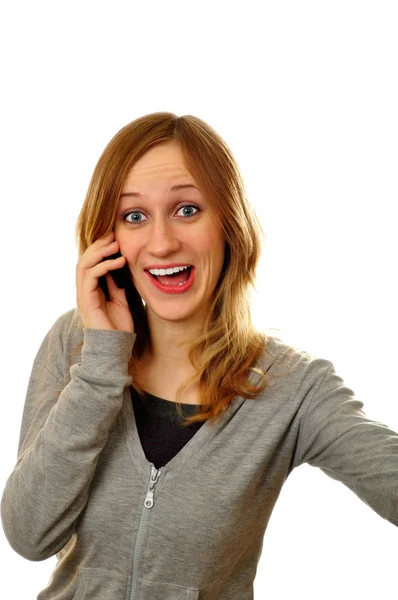 Здивована жінка плаче на мобільному телефоні на білому тлі — стокове фото