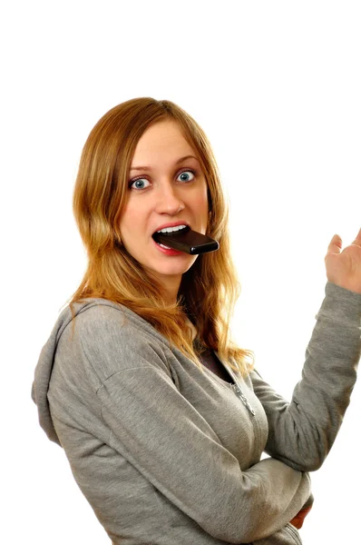 Attractive woman biting her cellphone — Stock Photo, Image