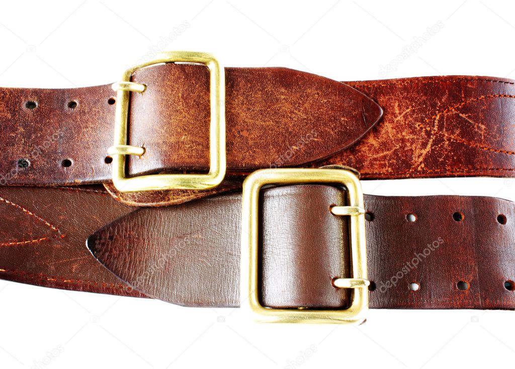 Old leather belts on white