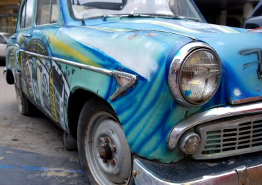 Old car with graffiti clipart