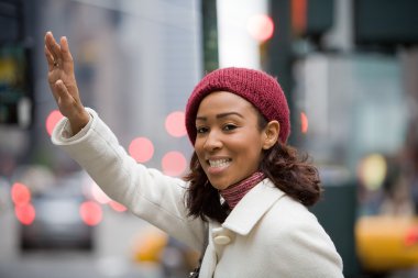 Woman Hailing A Cab clipart