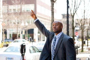 Business Man Hailing a Taxi Cab clipart