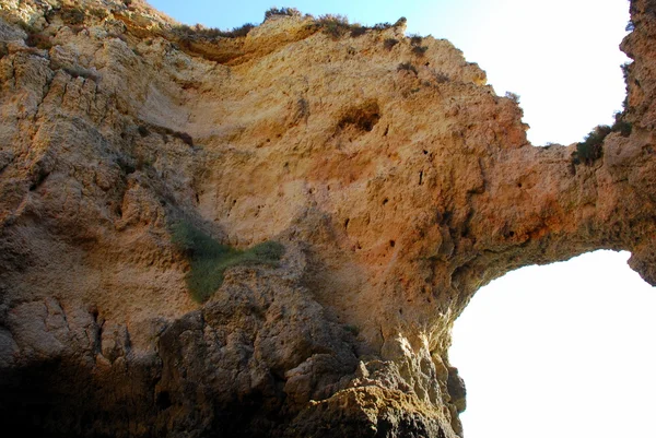 Caves in the cliffs yellow in Lagos in the Algarve Portugal — Stock Photo, Image