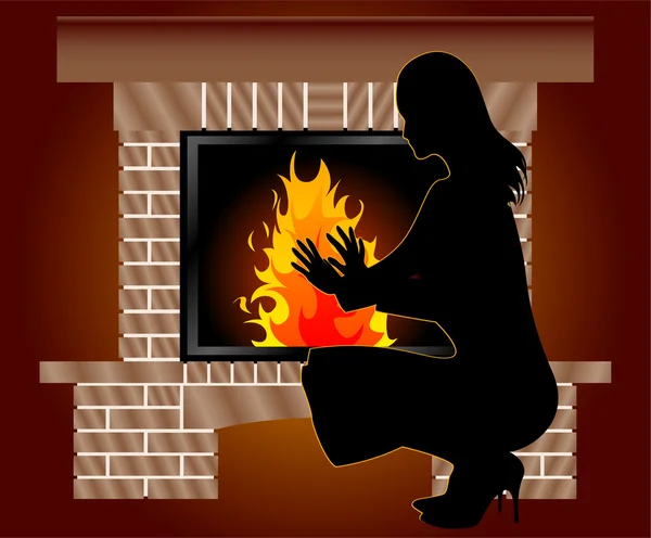Femme est chauffée près de la cheminée — Photo