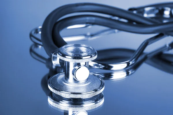 Stethoscope on blue background Stock Picture