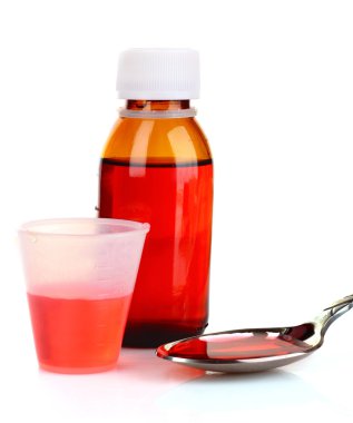 Cough medicine bottle with poured dose on counter clipart
