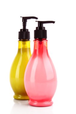 Pink andgreen soap bottles on white clipart