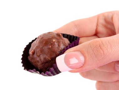 Chocolate candy in the hand on white clipart