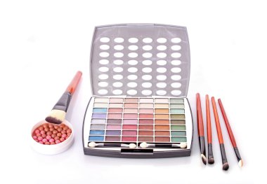 Big eye shadow kit, rouge and brushes on white background clipart