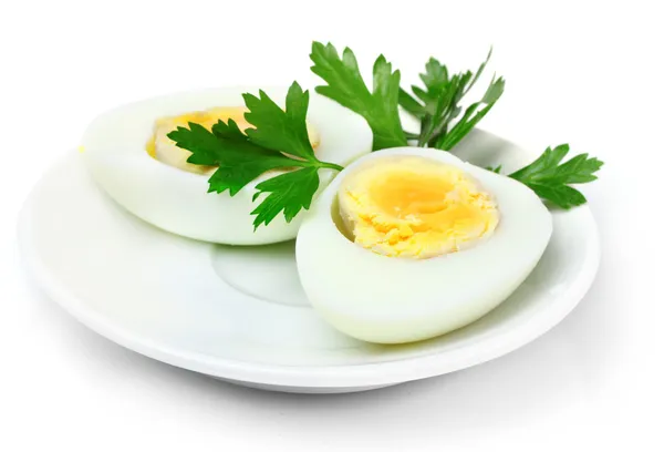 Vařené vejce a petržel na desce — Stock fotografie