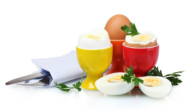 Gekochte Eier in hellen Ständern und Besteck — Stockfoto