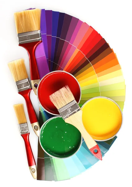 Open tin cans with paint, brushes and palette — Stock Photo, Image