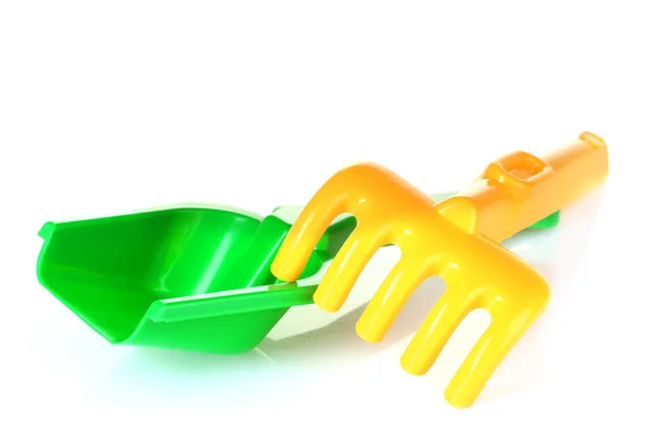 Children's toy rake and shovel — Stock Photo, Image