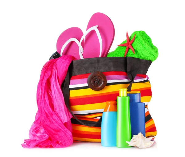 Bright striped bag with beach things — Stock Photo, Image