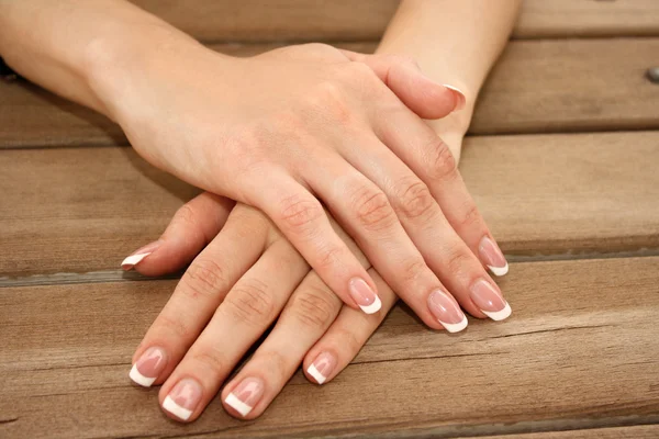 Woman Hands With French Manicure — Stock Photo © Belchonock #6660343