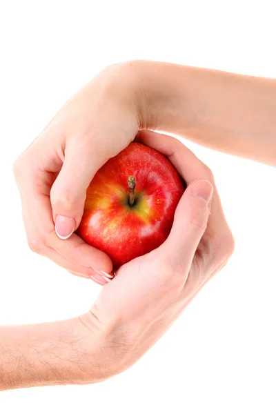 Jabłko między mężczyzną i kobietą ręka na białym tle — Zdjęcie stockowe
