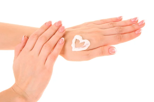 stock image Closeup of beautiful female hands applying hand cream on red ba