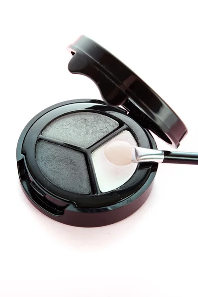 Cosmetici professionali. ombretti di colo bianco, grigio e nero — Foto Stock