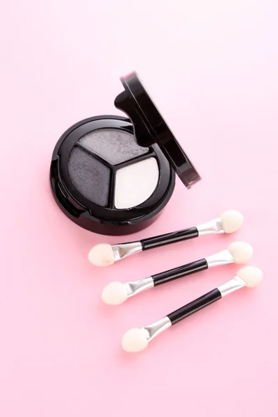 Professional cosmetics. Eyeshadows of white, grey and black colo — Stock Photo, Image