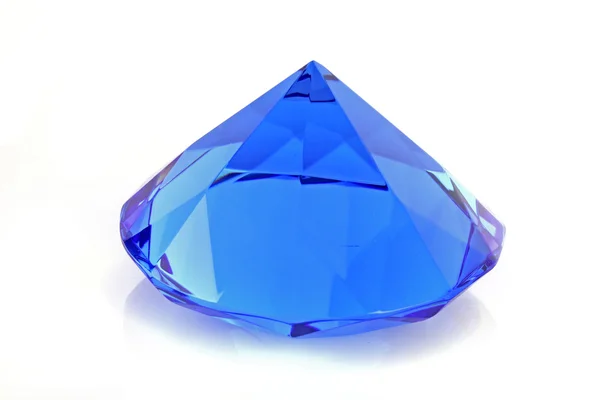 Close up of blue diamond over white background — Stock Photo, Image