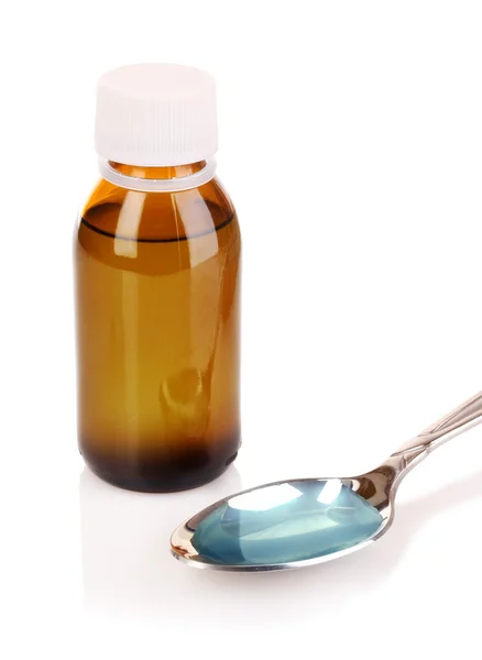 Spoon of cough medicine and bottle isolated on white backgroun — Stock Photo, Image