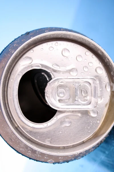 stock image Closeup of metallic beer with water drops on blue background