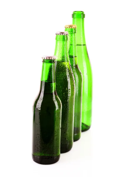 Many bottles of beer isolated on white — Stock Photo, Image