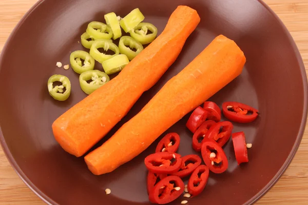Carrots with pepper on the plate — Stock Photo, Image