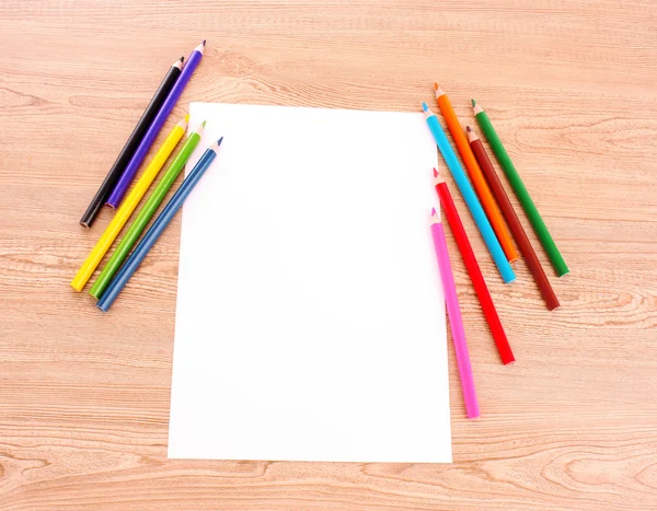 Paper and pencils on the wooden table — Stock Photo, Image