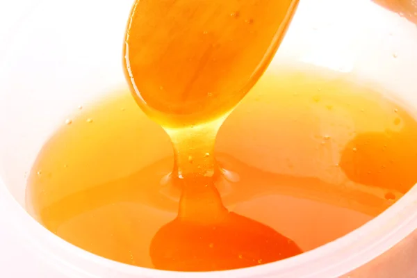 Houten lepel met honing — Stockfoto