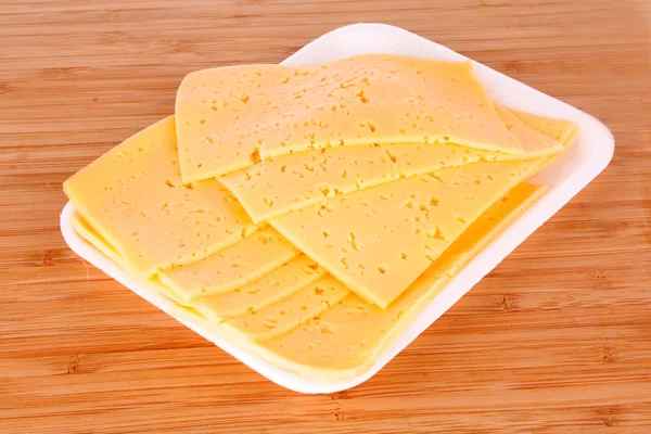 Żółty ser na drewniane tła — Zdjęcie stockowe