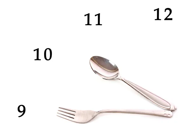 Klok gemaakt van lepel en vork, geïsoleerd — Stockfoto