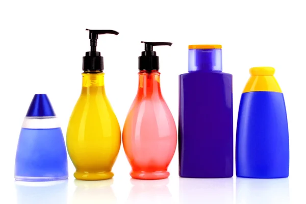Bottles of health and beauty products on white background — Stock Photo, Image