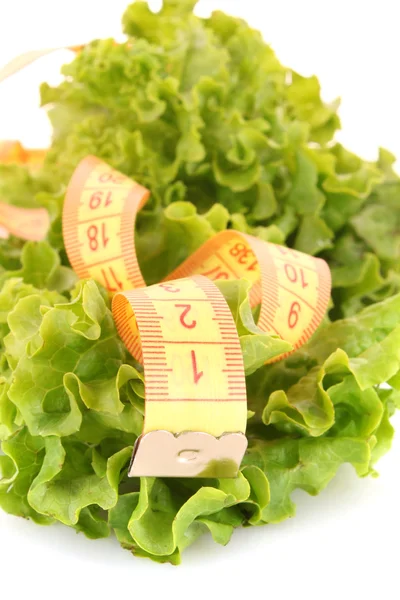 Tape measure and lettuce on white — Stock Photo, Image