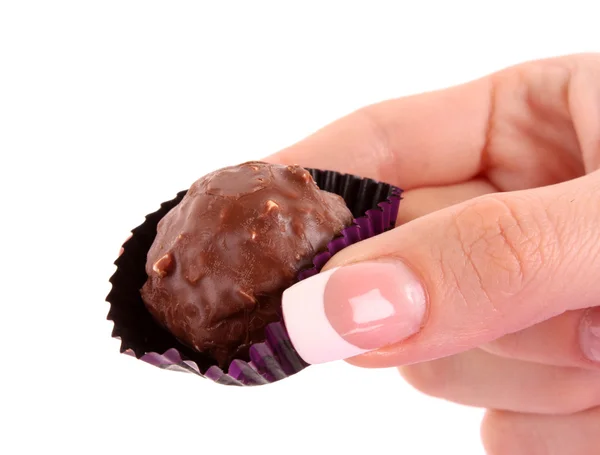 Choklad godis i handen på vit — Stockfoto